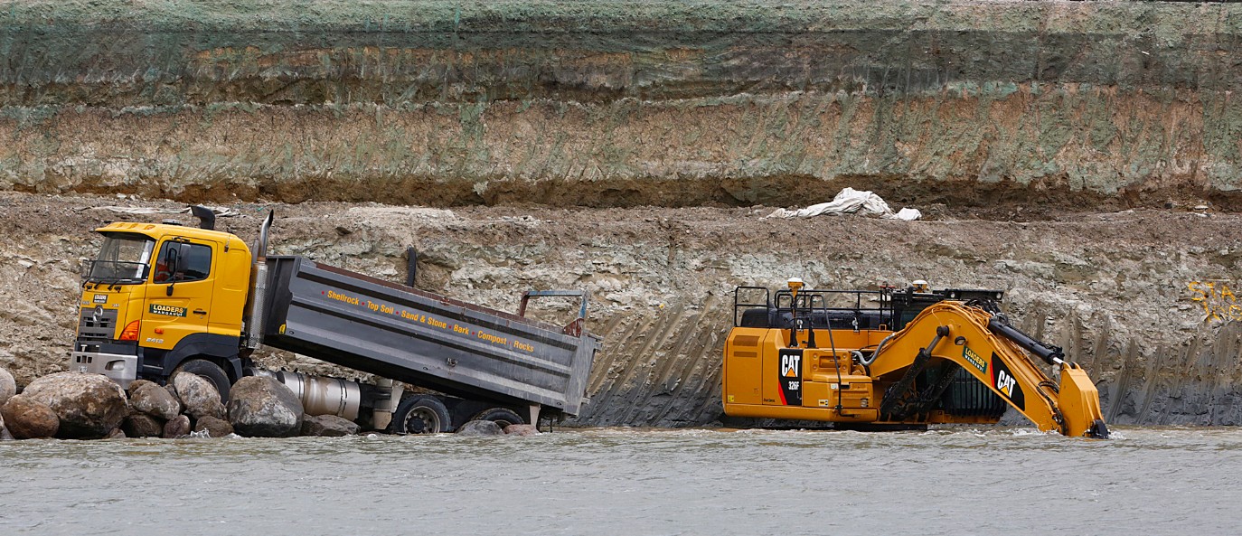 Excavation works alongside a river
